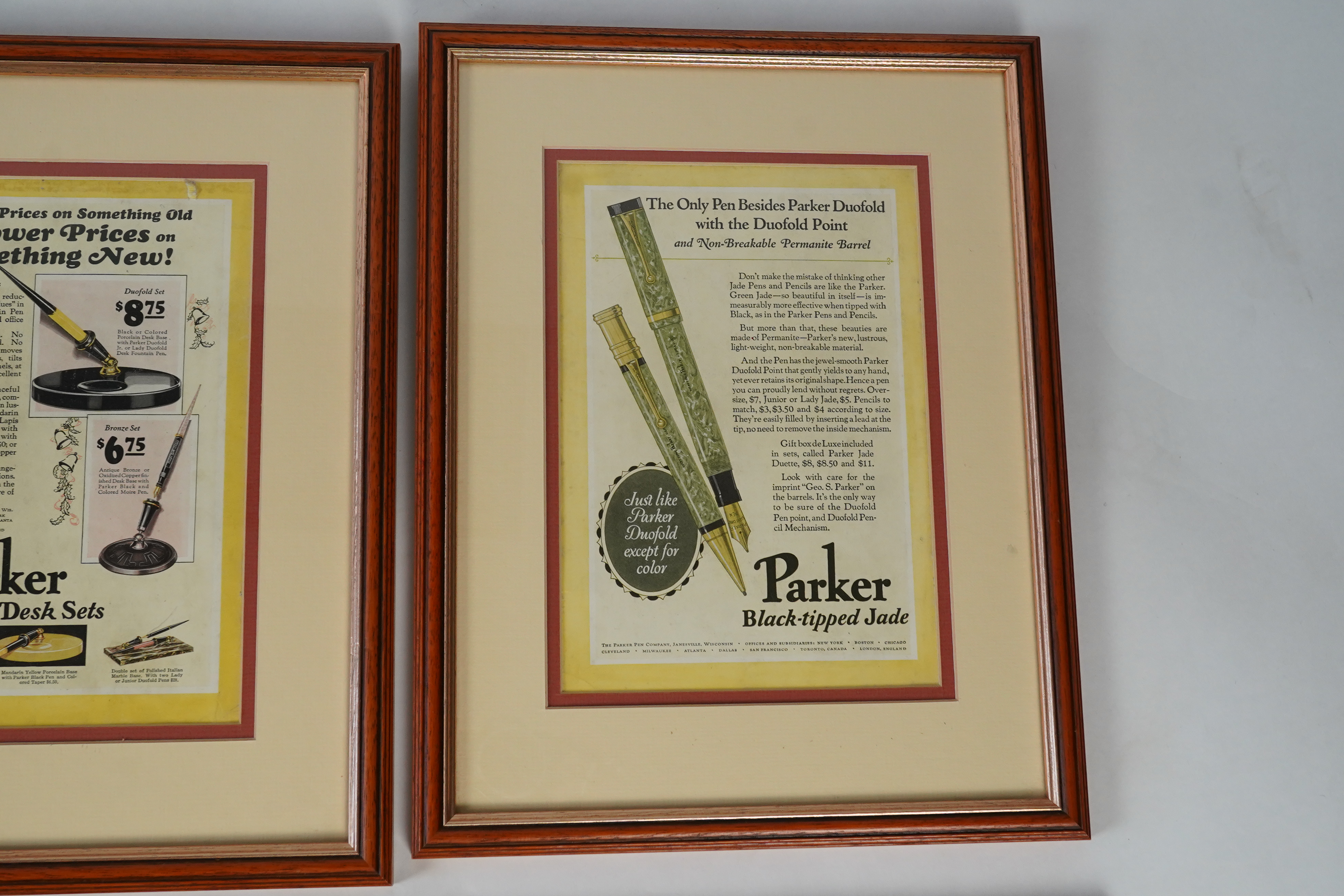 Framed fountain pen adverts (12)